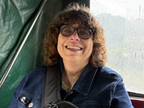 Travel photo Christine in a horse-drawn carriage.